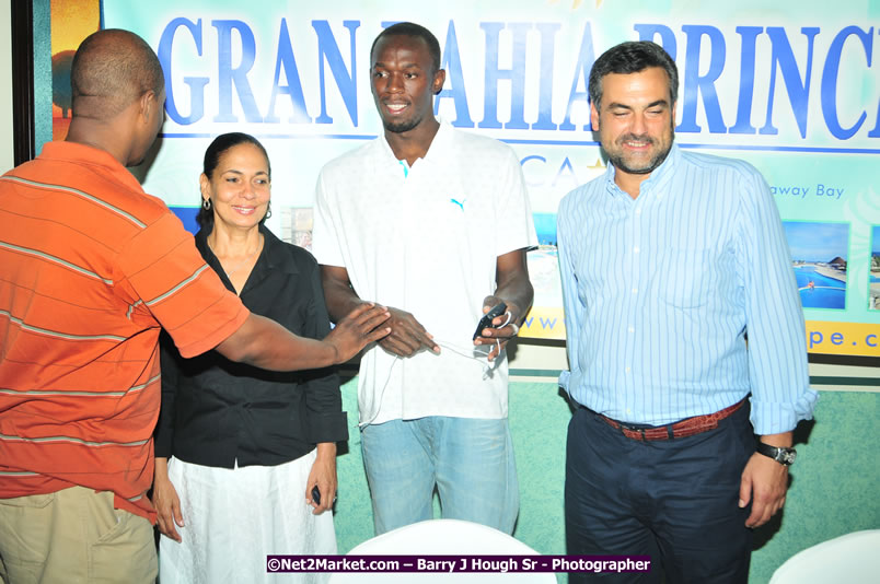 Usain Bolt of Jamaica - The Fastest Man In The World  - Usain Bolt Homecoming Celebrations - Press Conference at the Grand Bahia Principe &amp; Sherwood Content - Waldensia Primary School - Photographs by Net2Market.com - Barry J. Hough Sr. Photojournalist/Photograper - Photographs taken with a Nikon D300 - Negril Travel Guide, Negril Jamaica WI - http://www.negriltravelguide.com - info@negriltravelguide.com...!